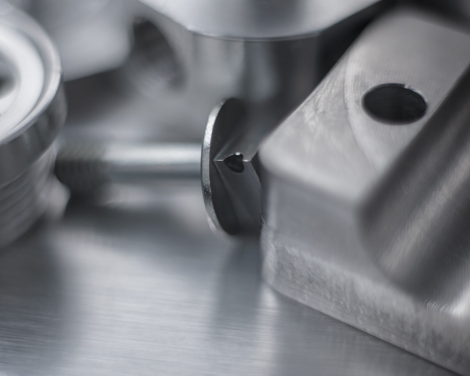 Precision gauges and measurement tools arranged on a technical tray.